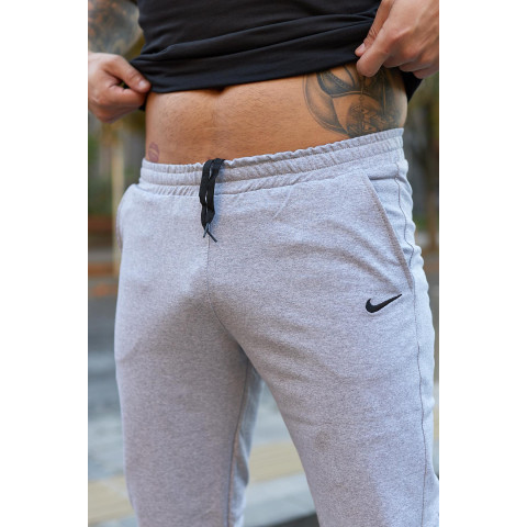 Штани чоловічі трикотажні Nike світло-сірі