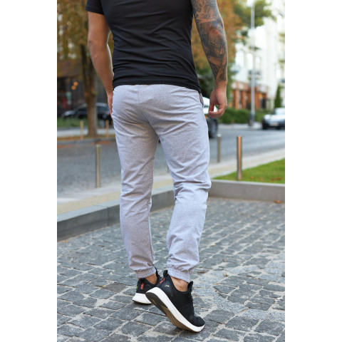 Штани чоловічі трикотажні Nike світло-сірі