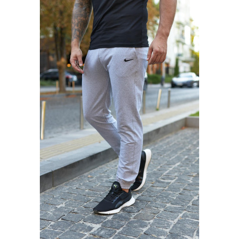 Штани чоловічі трикотажні Nike світло-сірі