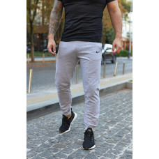 Штани чоловічі трикотажні Nike світло-сірі