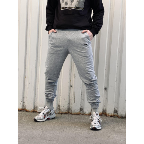 Штани чоловічі трикотажні Nike світло-сірі