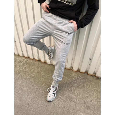 Штани чоловічі трикотажні Nike світло-сірі