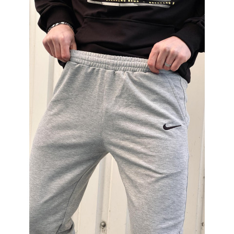 Штани чоловічі трикотажні Nike світло-сірі