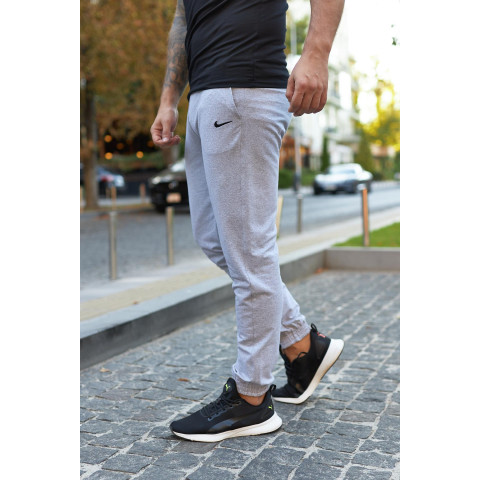 Штани чоловічі трикотажні Nike світло-сірі