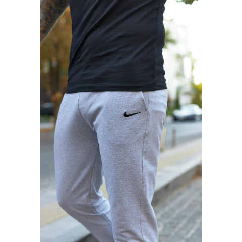 Штани чоловічі трикотажні Nike світло-сірі